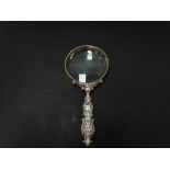 A George V silver filled handled magnifying glass, Birmingham 1924, the glass surround stamped '