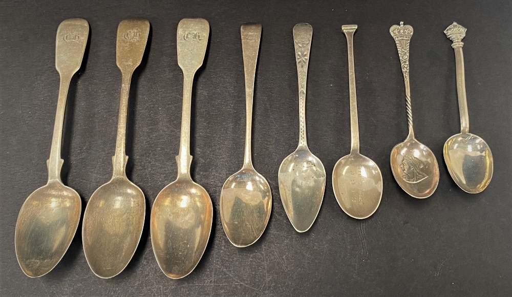 A set of three Victorian silver Fiddle pattern teaspoons, together with two George III silver