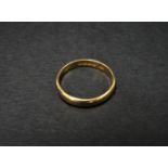 A 22ct. hallmarked gold band ring, size H/I, weight 1.8g approx. and a 9ct. hallmarked gold signet