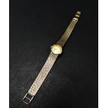 A Tudor ladies 9ct. hallmarked gold bracelet manual wind wristwatch, the 13mm champagne dial