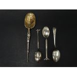 An Edwardian silver gilt copy of 'The Anointing Spoon', Birmingham 1910, together with a pair of