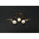 A 9ct. hallmarked gold single pearl set ring, together with a pair of 9ct. gold pearl drop earrings,