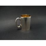 A George V silver christening mug of plain form with engraved dedication, Birmingham 1928, height