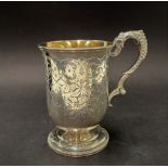 A Victorian silver footed cup with strapwork and foliate engraved decoration and a cartouche