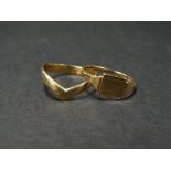 A 9ct. hallmarked gold wishbone ring, together with a 9ct. hallmarked gold signet ring, weight 2.