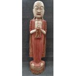 A 20th century oriental carved and painted wood figure of an immortal, height 103cm.