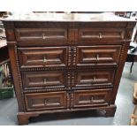 A late 17th/early 18th century oak chest of drawers, the moulded top over four graduated mitre