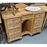 A Victorian stripped pine kneehole breakfront dressing chest, the serpentine top rail over an