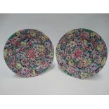 A pair of 20th century Chinese mille fiori famille rose plates with gilt highlights, red four