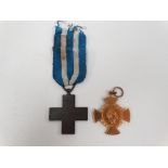 A German 'From Rock To Sea' medal and an Italian War Merit Cross.