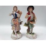 A pair of 19th century Capodimonte Naples porcelain figures, one depicting a woman flower seller,
