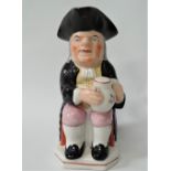 A Staffordshire Pottery toby jug, height 25cm (chip to tricorn hat).