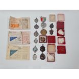 Interesting miscellaneous items, including five silver hallmarked shield fobs, two bronze shield