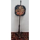 A 19th century painted simulated pole screen with needlework panel.