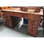 A late 19th century mahogany twin pedestal desk of typical form fitted eleven drawers, width 124cm.