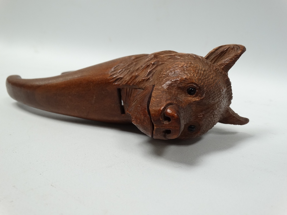 A Black Forest carved wood bear head nutcracker with black glass inset eyes, length 19cm. - Image 2 of 2