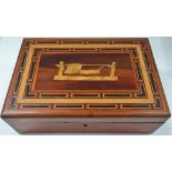 A 19th century French rectangular inlaid hinge lidded work box, the parquetry lid inset with a