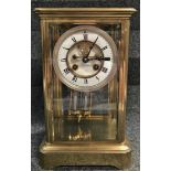 A late 19th century brass case mantle clock with two train French movement, mercury filled