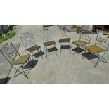 A set of six 20th century French wrought iron folding garden chairs with wooden seats.