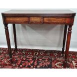 An early 19th century mahogany fold top tea table with turned legs and boxwood strung inlays,