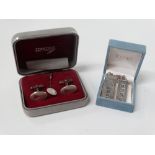 A pair of silver Concorde cufflinks, together with a silver Concorde ingot and one other ingot.