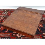 An Edwardian oak table top writing slope with hinged lid, width 32cm.