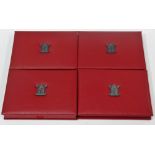 A cased set of four Royal Mint proof sets, two with a face value of £11.38 and two with a face value