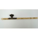 A late 19th century Chinese bone and white metal mounted opium pipe, the bone engraved with numerous