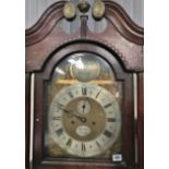 An oak cased eight day longcase clock by Alfred Minnis of Spalding with broken arch pediment,