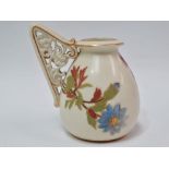 A Royal Worcester vase with reticulated floral scroll moulded single handle, No.1137, puce printed