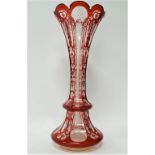 A Bohemian glass ruby overlay and white enamel and gilt painted flared vase, height 39.5cm (rim
