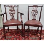 A set of six Chippendale style dining chairs circa 1900, with well carved backs, the arms with