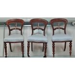 A set of six mahogany 19th century balloon back dining chairs with overstuffed seats and turned