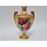A Royal Worcester blush ivory pedestal, twin lug handle vase, No.152/H15.54, painted with roses
