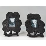 A pair of early 20th century Irish bog oak miniature photograph frames shaped as clover leaves,