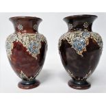 A pair of Doulton Lambeth small baluster vases with foliate applied decoration, height 15cm.