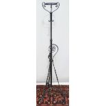 A late 19th century wrought iron oil lamp stand in Gothic taste.