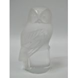 A Lalique glass owl moulded paperweight, inscribed 'Lalique France', height 9cm.