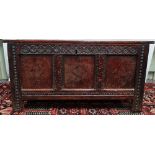 An 18th century English oak coffer with three panelled front inlaid with bi colour lozenges, the
