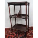 A mahogany side table fitted with three shelves on cabriole feet, height 86cm.