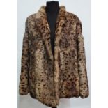 A coney fur ladies jacket with leopard print design, with label for Daphmond, London, size 14/16.