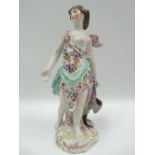 A 19th century Derby style porcelain group depicting Juno with peacock at her feet, height 27cm.