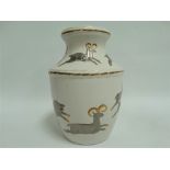 An Art Deco continental pottery relief moulded vase decorated with a medieval scene of an archer on