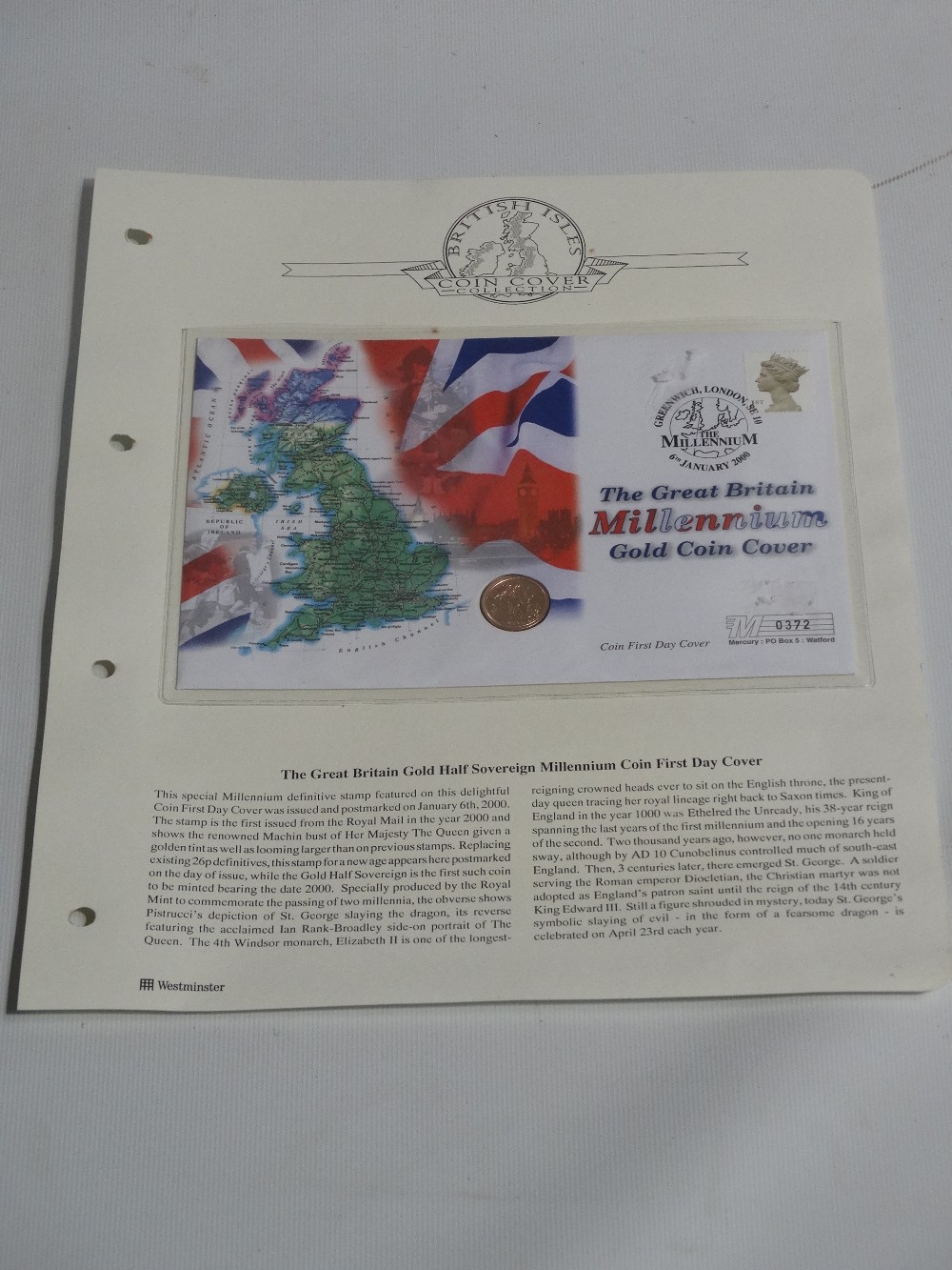A gold half sovereign millenium first day cover coin.