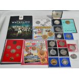 A collection of commemorative coins, including a Royal Mint decimal set.