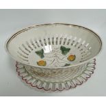 An 18th century pearlware oval section pierced strawberry basket, the basket with pedestal broken