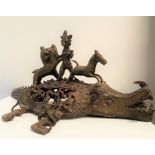 A Benin bronze group depicting a stylised lion figure and horse upon a mythical crocodile style