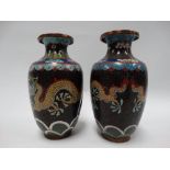 A pair of Chinese cloisonne vases, both painted with a pair of coiled dragons chasing the flaming
