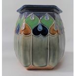 A Royal Doulton hexagonal section stoneware vase No.7763, with tubelined decoration, height 14cm.