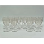 A harlequin set of seventeen stemmed glasses with barley and hops scroll wheel engraved